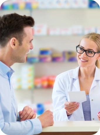 pharmacist smiling at the male customer